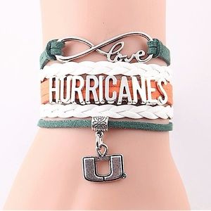 NWT- Infinity Love Hurricane Football with Logo Charm and Lobster Clay